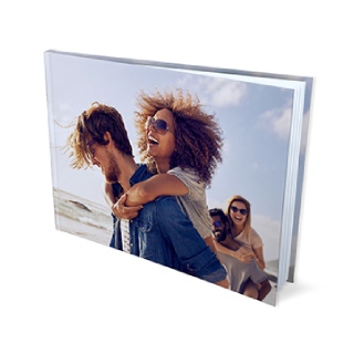 Photo Books: A hardcover photo book with a full wrap-around photo of friends on the beach.
