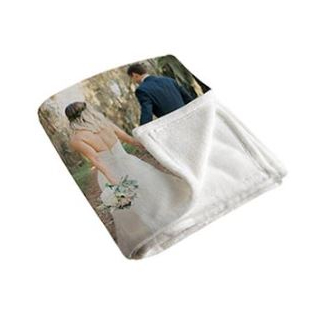 Blankets: A folded photo blanket showing a wedding picture on the front and the soft fleece backing.
