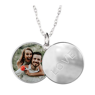 Sliding locket Necklace: An open silver sliding locket with a photo of a couple on one side and the word love on the other.