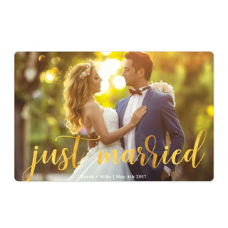 Magnet Wedding Gifts: A photo magnet of a bride and groom with the text just married in a gold script.