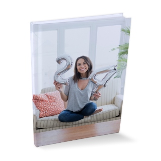 photo books: A hardcover photo book with a full-photo cover of a woman celebrating her 24th birthday.