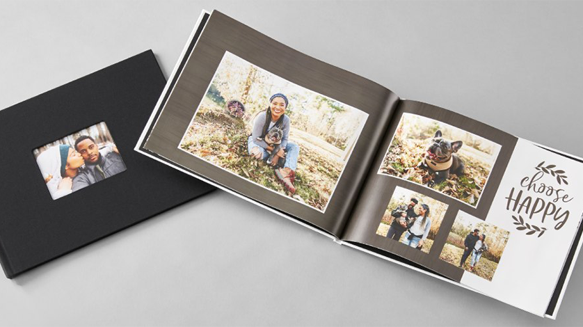 Everyday photo books: A black hardcover photo book with a window cover, shown next to an open copy displaying a photo collage.