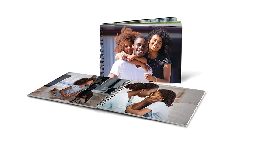 Same-Day 5x7 Flip Book: A spiral-bound flip book with a full-photo family cover, shown with an open copy displaying inside pages.