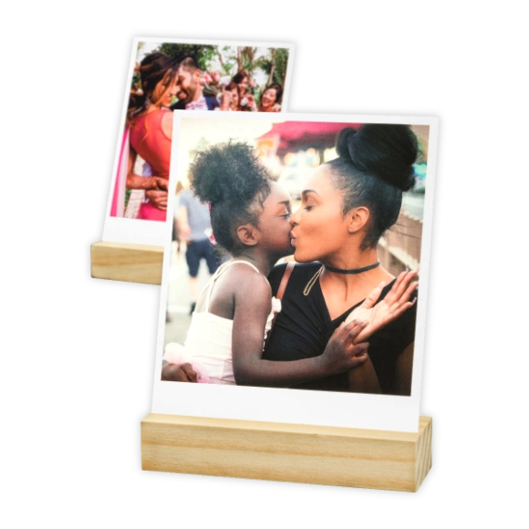 Retro Photo Prints: Two retro-style prints in wooden block stands, with the front photo showing a mother kissing her daughter.