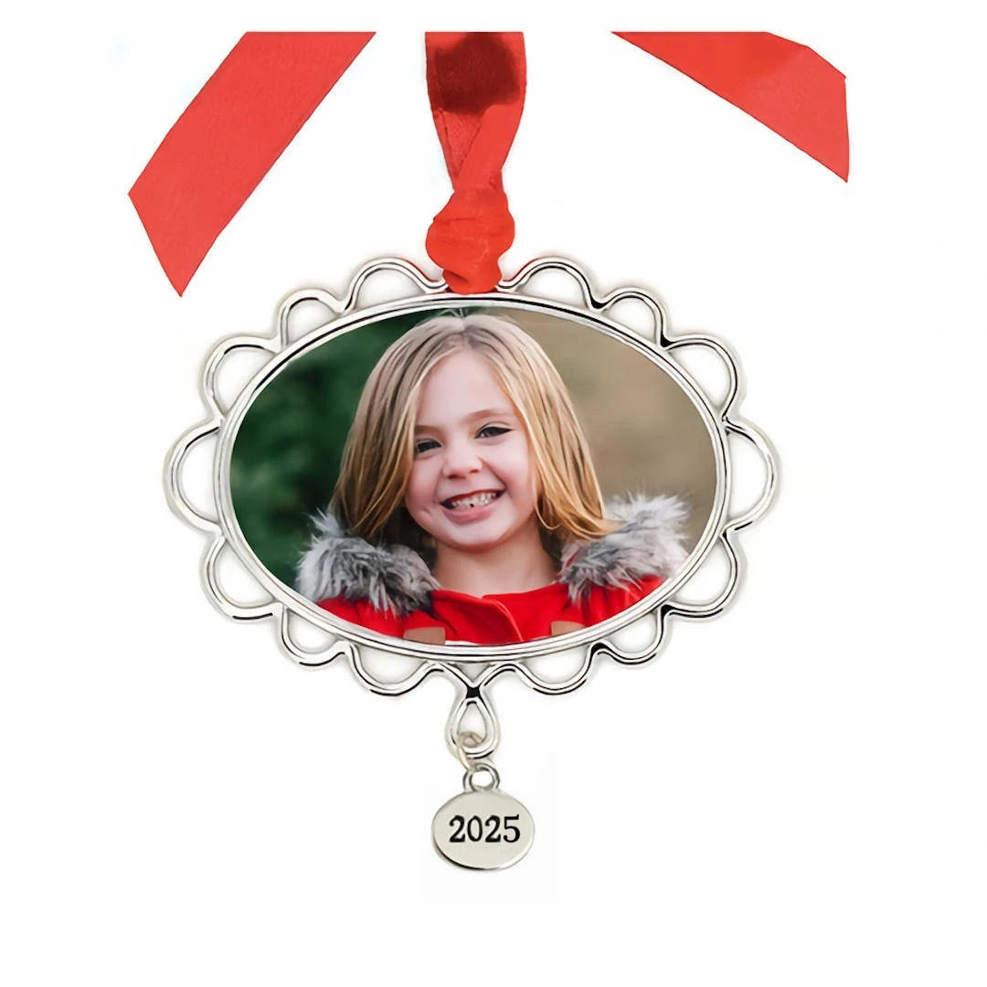 Metal Petal Frame Photo Ornament With Year Tag: A oval silver photo frame ornament with a petal shaped edge, a girl picture, and a year tag.