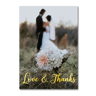 Wedding Note Cards: A wedding thank you card with a photo of a bouquet and the text Love & Thanks in a gold script.