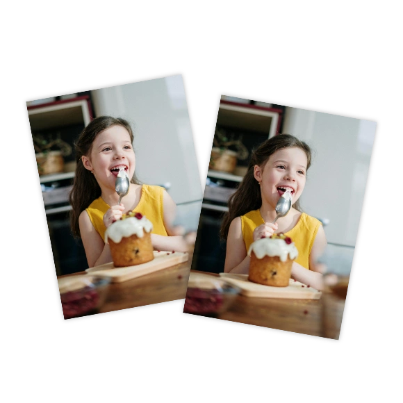 Wallet Prints: Two identical wallet-sized photo prints of a smiling young girl with a small cake.