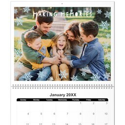 11x14 Wall Calendar- 12 Month: A personalized wall calendar open to January 2025, with the top page featuring a large family photo.